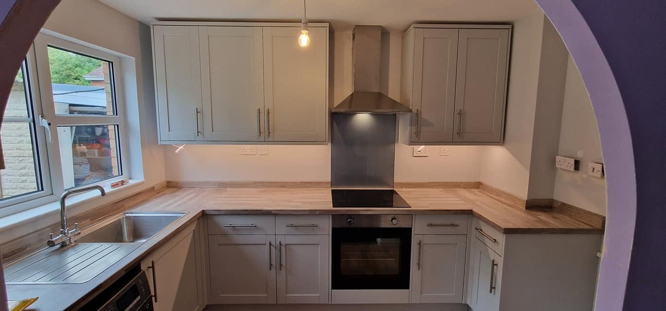 Completed Dove Grey kitchen with Authentic Grey Oak Block worktops